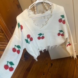 Ripped cherry sweater